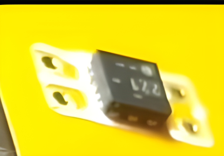 Populated PCB for DIY implant featuring a mounted chip, designed for biohacking and body modification projects